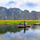 Icca Landscape With Boat, Mountains And Clouds Van Long Natural Reserve 128855443 Piter Ha Son